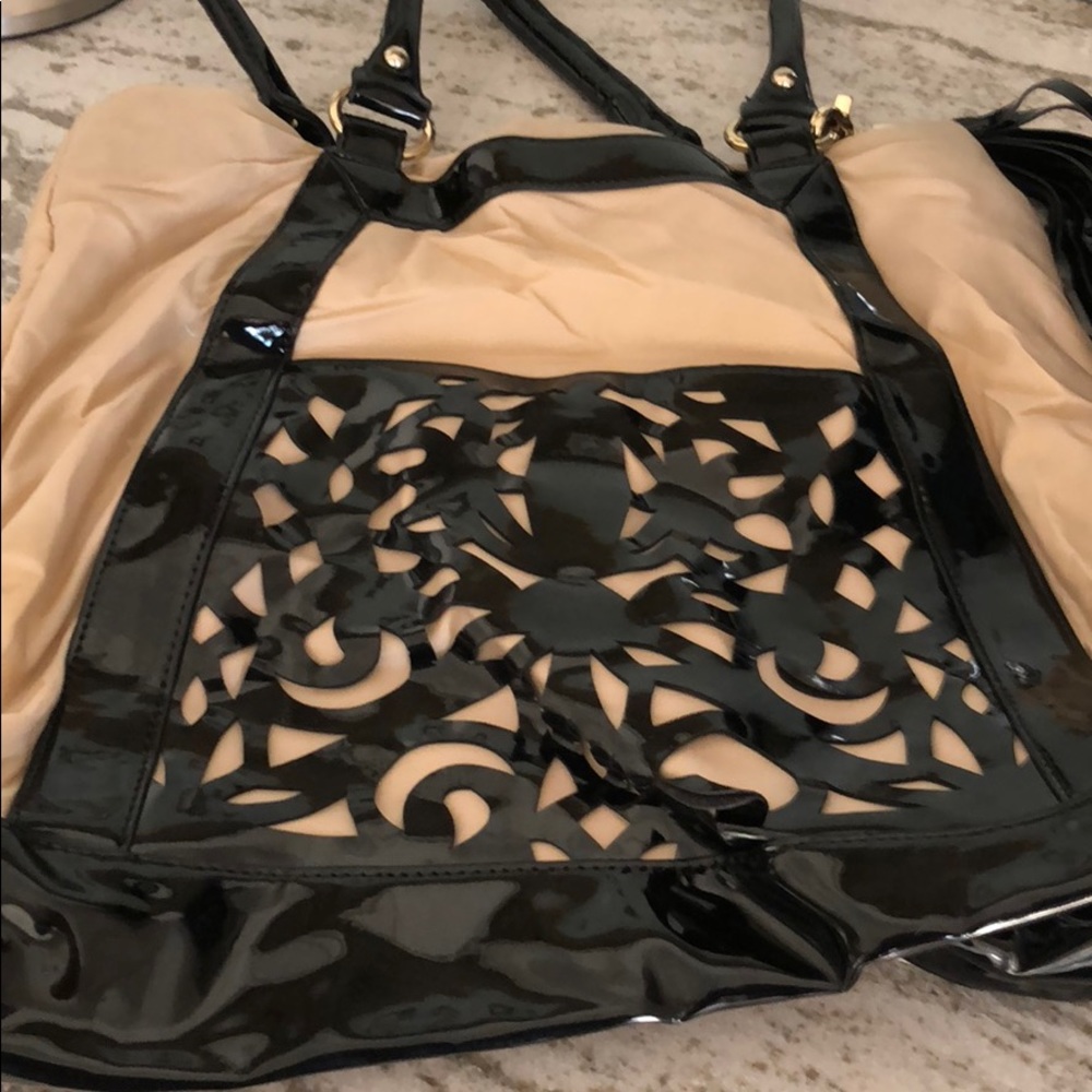 Sondra Roberts laser cut detail tote bag